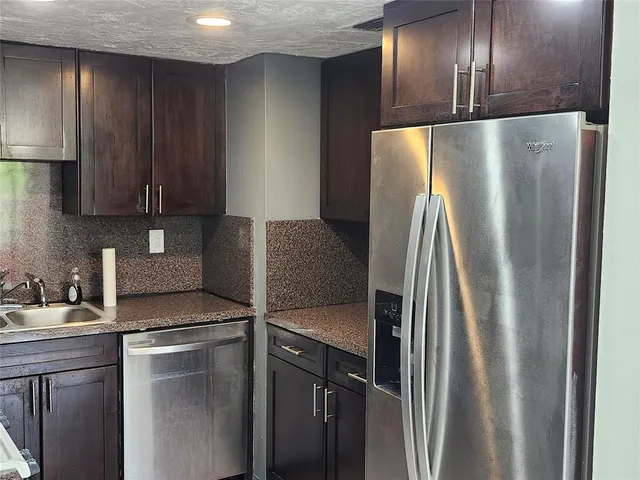 a view of a hallway with a white walls