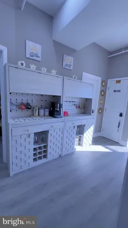 a view of kitchen with cabinets and wooden floor