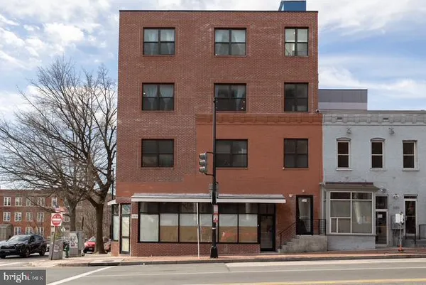 a front view of a building with a street