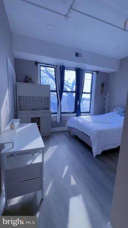 a bedroom with a bed and a fireplace