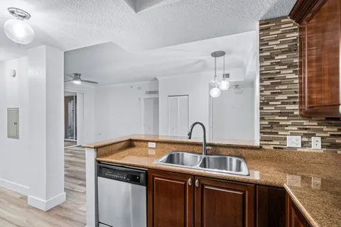 a kitchen with a sink and cabinets