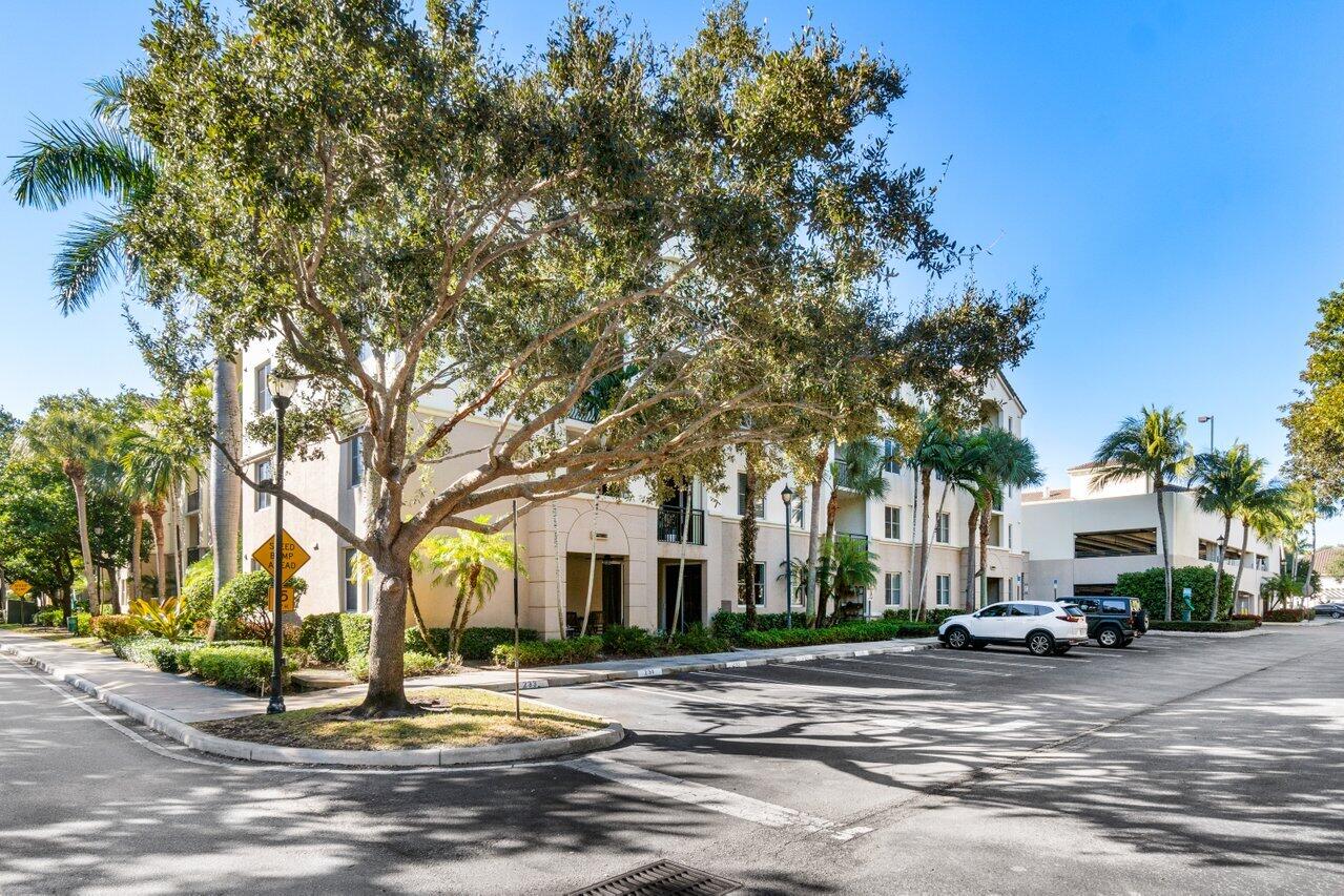 1117 Renaissance Way, Unit 117 Boynton Beach, FL 33426 - Photo 2 of 31 a view of a town with trees