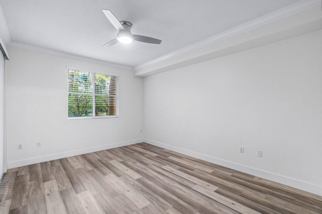 1117 Renaissance Way, Unit 117 Boynton Beach, FL 33426 - Photo 21 of 31 an empty room with a window