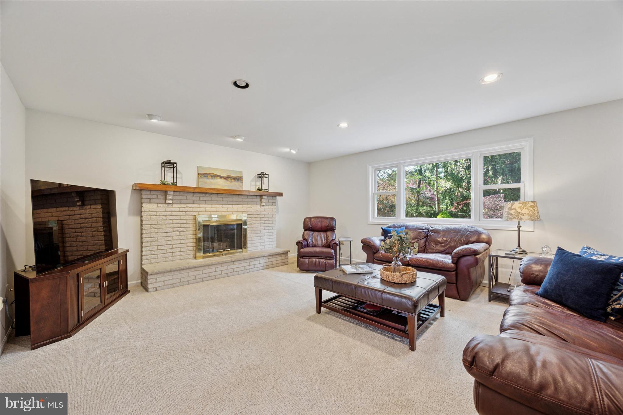713 Buckley Road Blue Bell, PA 19422 - Photo 11 of 44 a living room with furniture and a flat screen tv