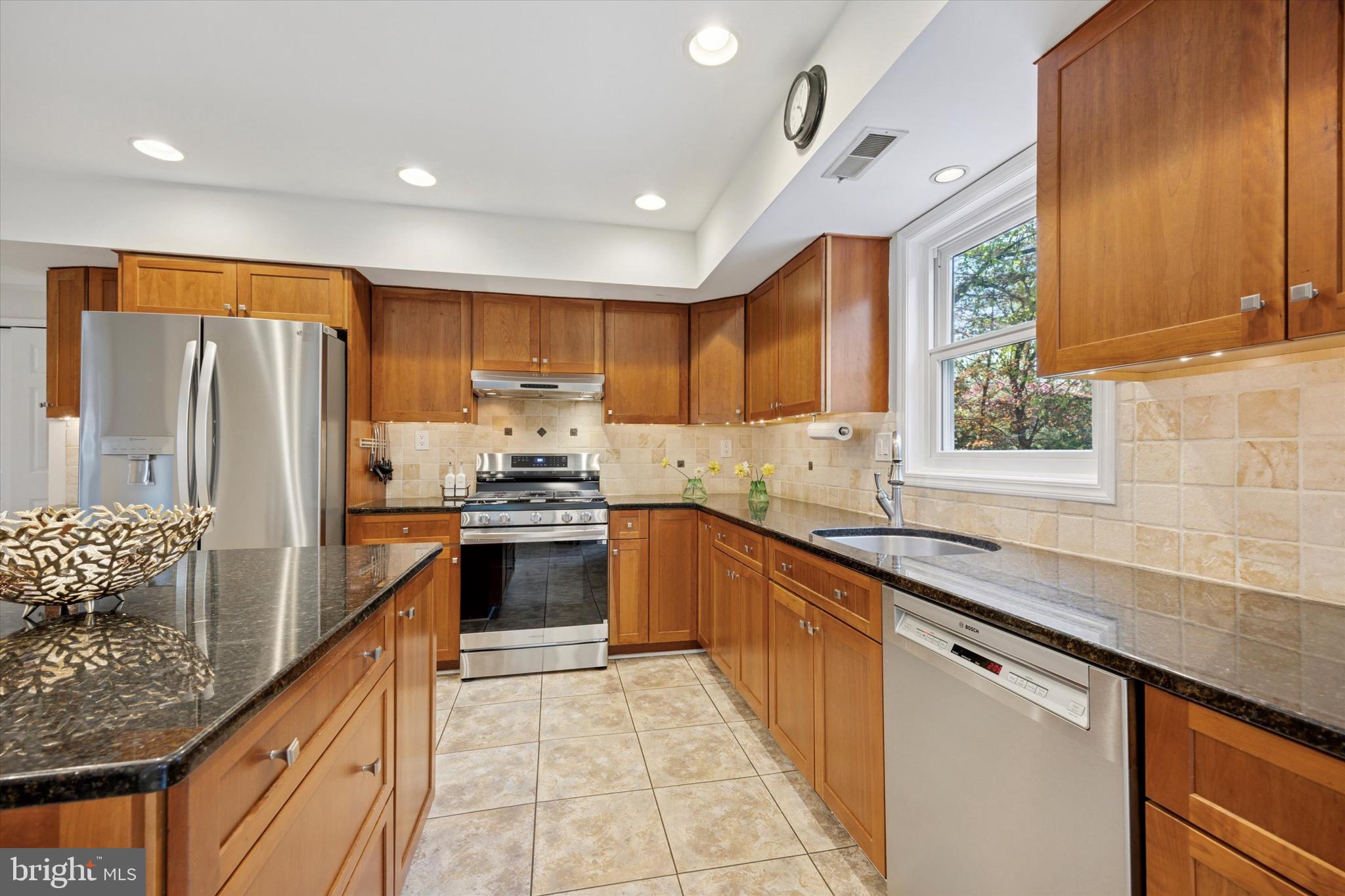 713 Buckley Road Blue Bell, PA 19422 - Photo 13 of 44 a kitchen with stainless steel appliances granite countertop a sink stove and refrigerator