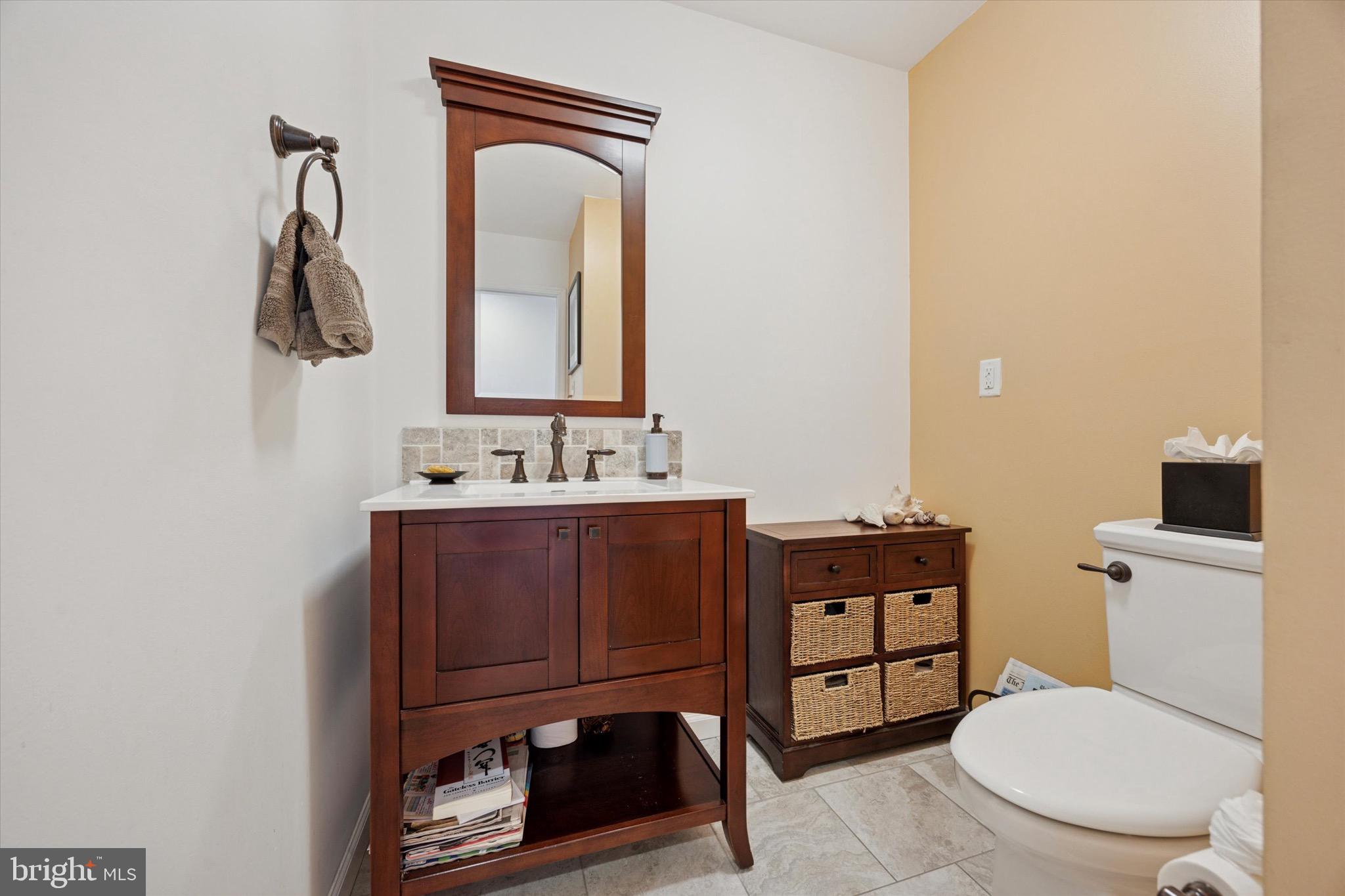 713 Buckley Road Blue Bell, PA 19422 - Photo 16 of 44 a bathroom with a toilet a sink and mirror