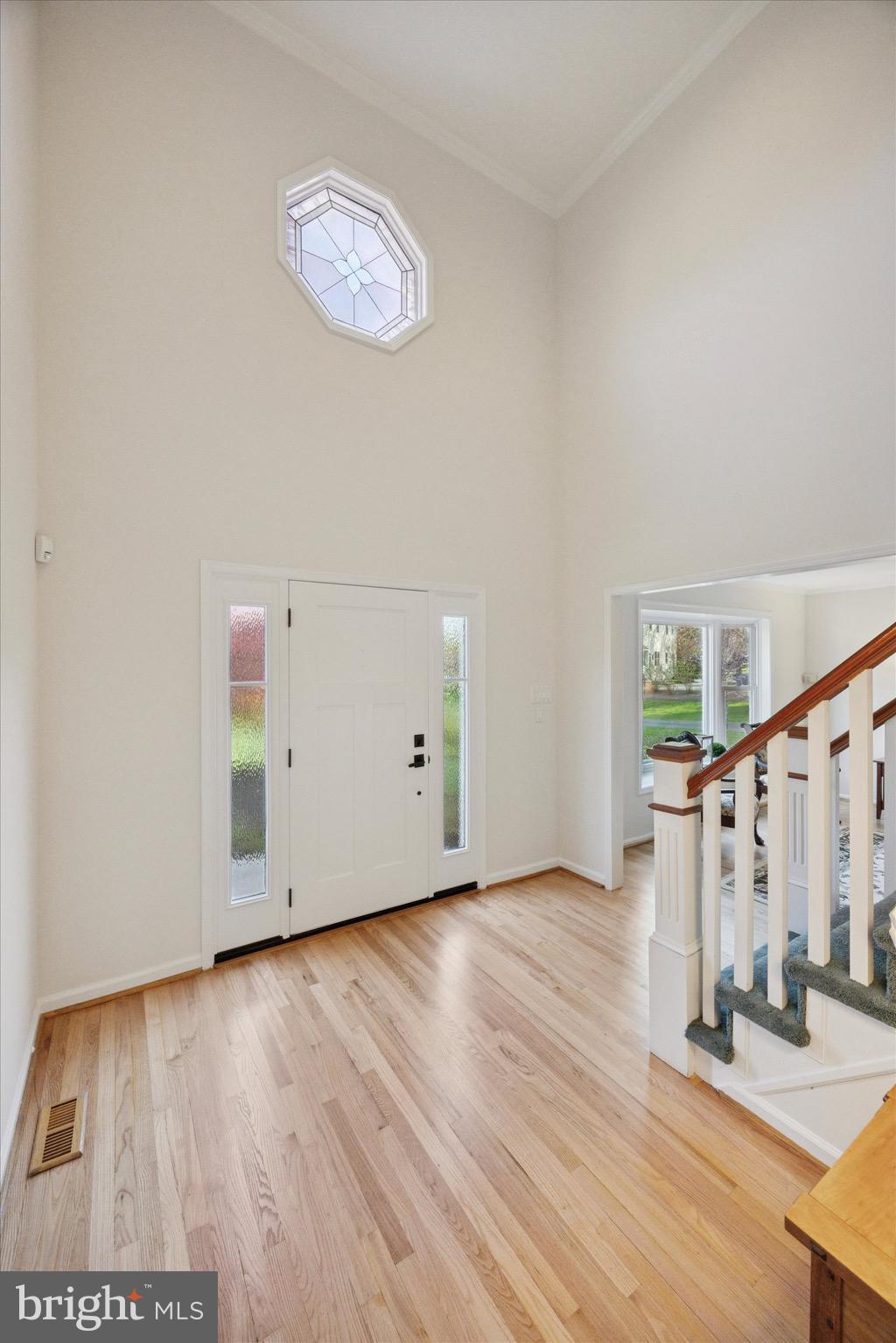 713 Buckley Road Blue Bell, PA 19422 - Photo 19 of 44 a view of an empty room with wooden floor and stairs