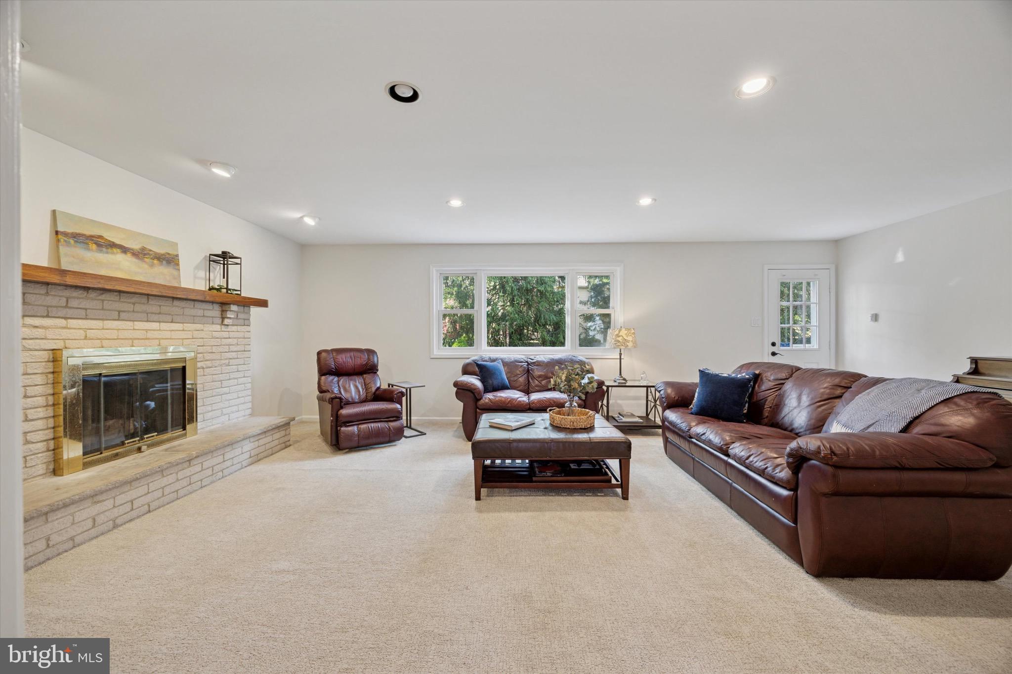 713 Buckley Road Blue Bell, PA 19422 - Photo 10 of 44 a living room with furniture and a fireplace
