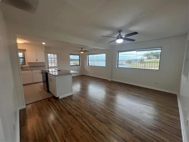 a kitchen that has a sink and a stove