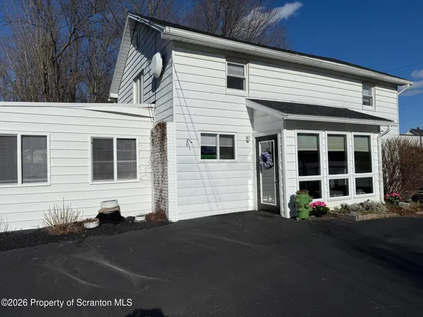 a kitchen with stainless steel appliances granite countertop a stove a sink dishwasher and a refrigerator