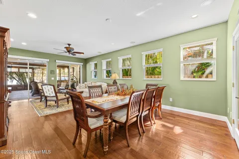 an aerial view of residential houses with outdoor space and swimming pool