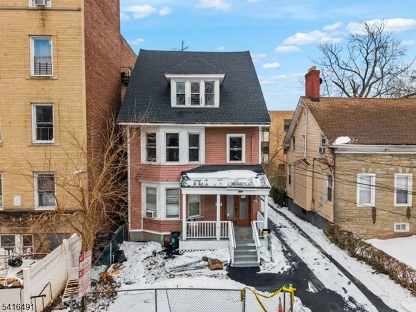 a aerial view of a house with a yard
