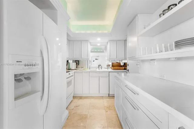 a kitchen with a sink and refrigerator