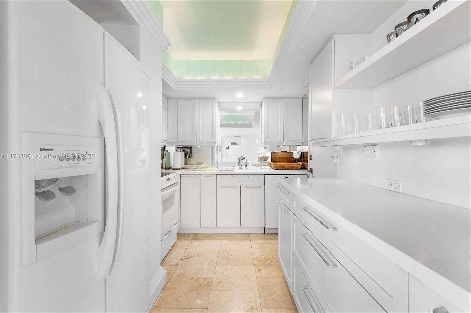 20 Island Avenue, Unit 1509 Miami Beach, FL 33139 - Photo 11 of 34 a kitchen with a sink and refrigerator
