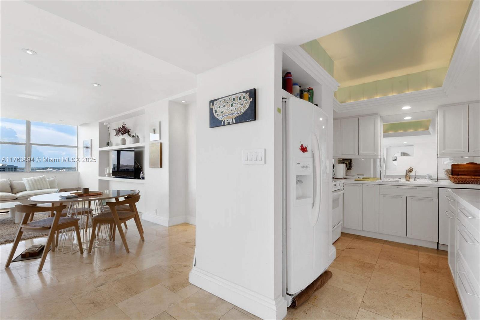 20 Island Avenue, Unit 1509 Miami Beach, FL 33139 - Photo 12 of 34 a view of kitchen with furniture and refrigerator