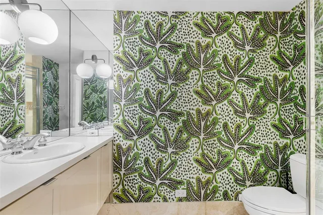 a bedroom with a large bed and a large window