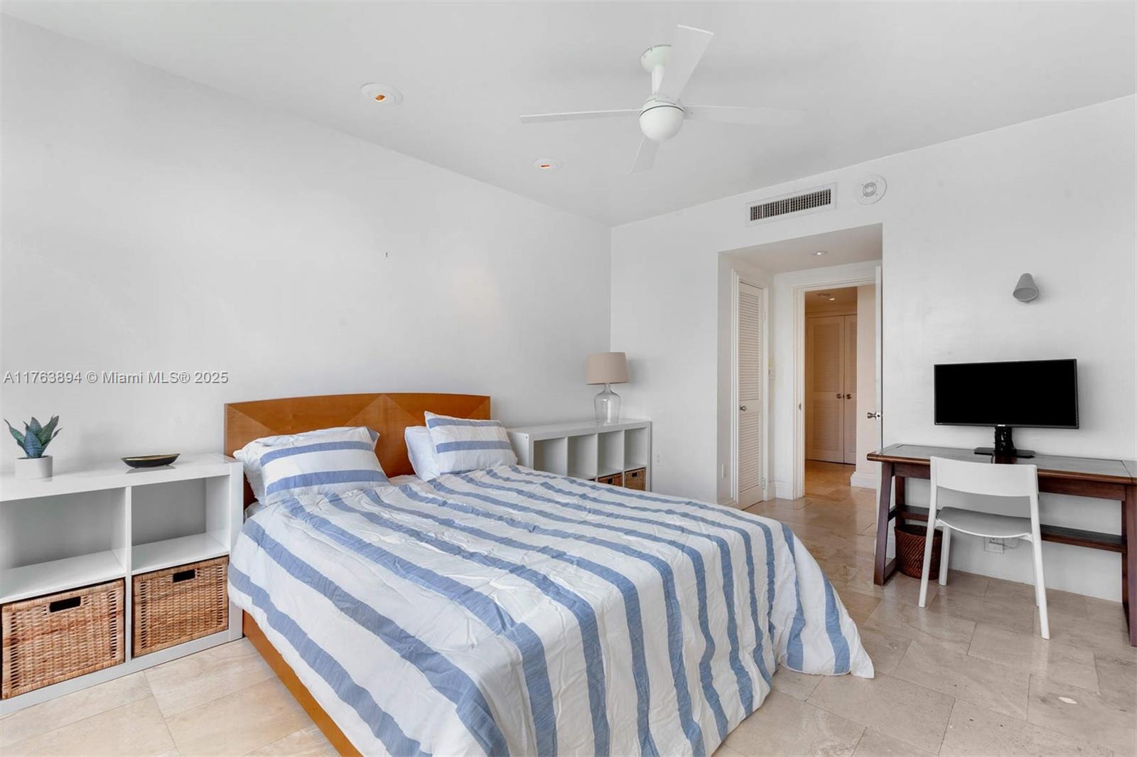 20 Island Avenue, Unit 1509 Miami Beach, FL 33139 - Photo 16 of 34 a bedroom with a bed and a flat screen tv