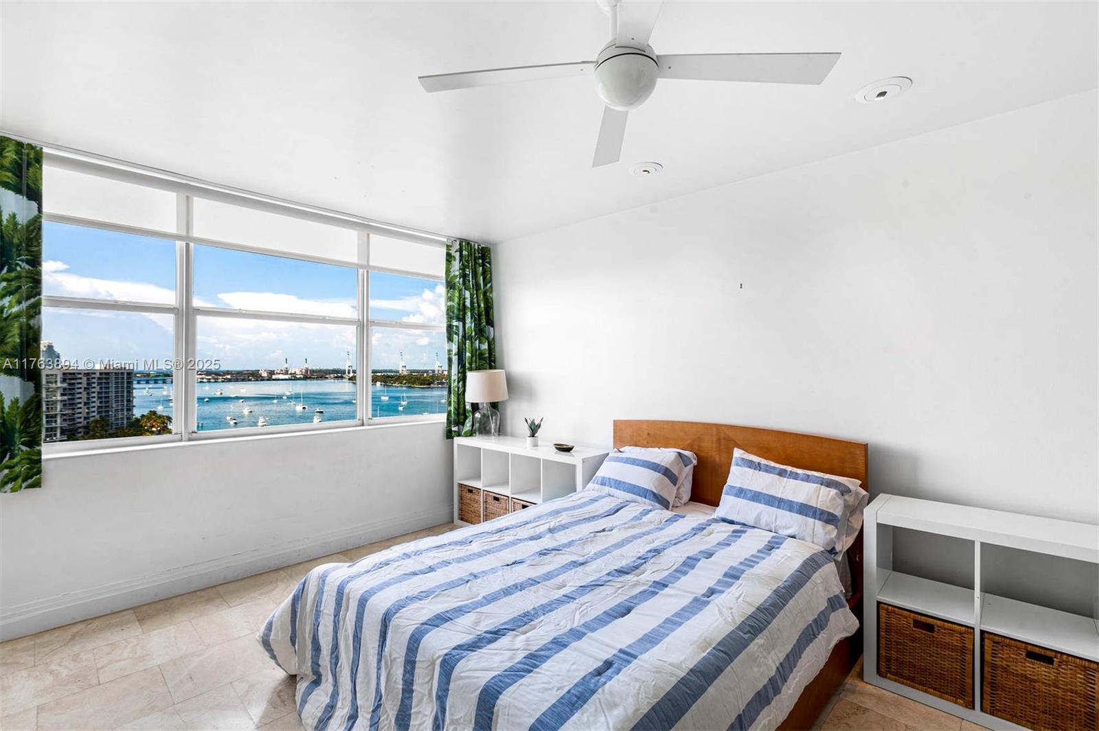 20 Island Avenue, Unit 1509 Miami Beach, FL 33139 - Photo 17 of 34 a bedroom with a bed and window