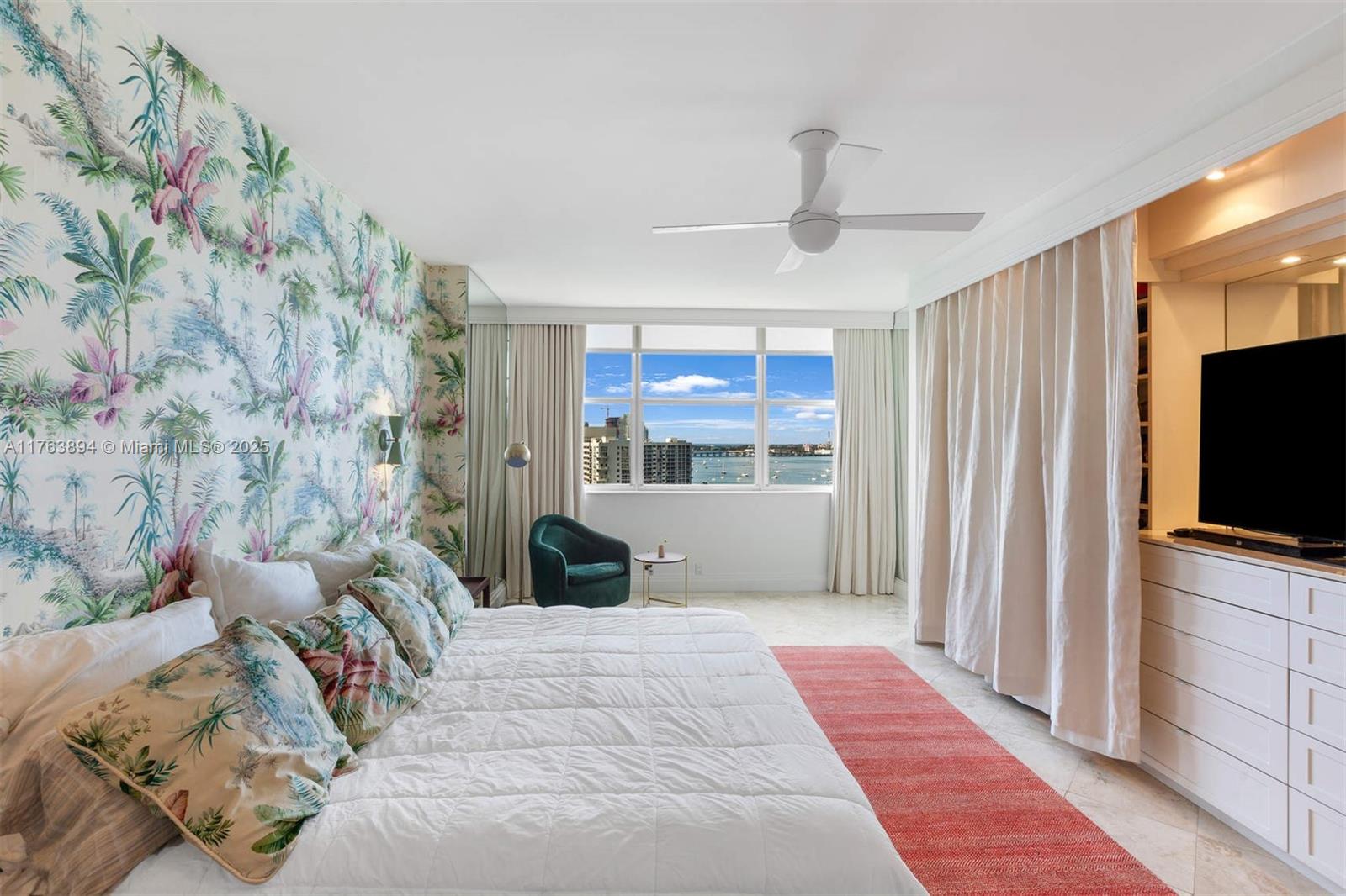 20 Island Avenue, Unit 1509 Miami Beach, FL 33139 - Photo 19 of 34 a bedroom with a bed and a flat screen tv