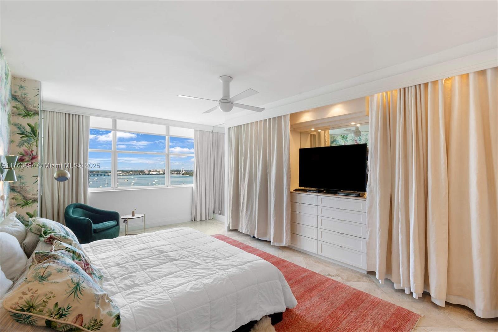 20 Island Avenue, Unit 1509 Miami Beach, FL 33139 - Photo 20 of 34 a bedroom with a bed and a flat screen tv