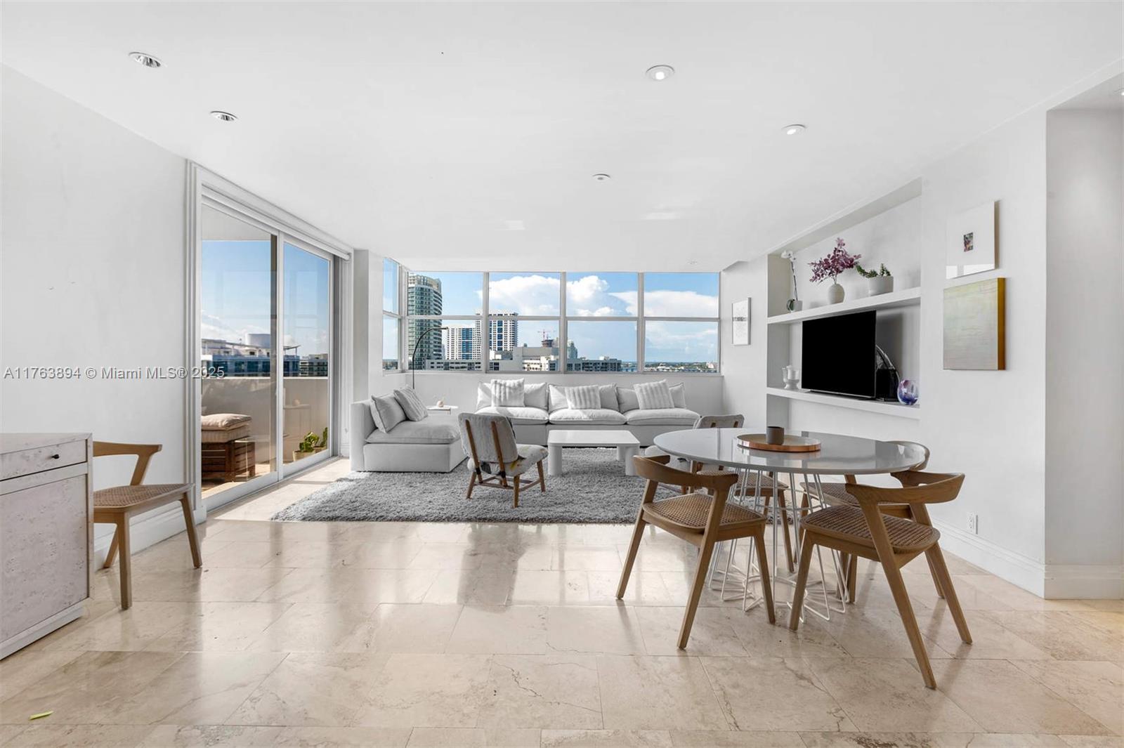 20 Island Avenue, Unit 1509 Miami Beach, FL 33139 - Photo 2 of 34 a living room with furniture and a flat screen tv
