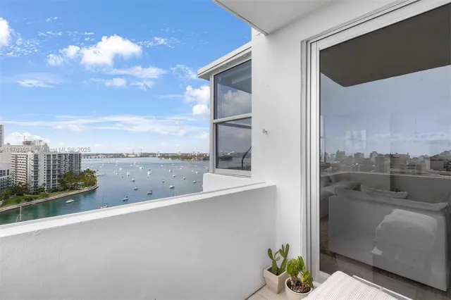 a terrace with outdoor seating and city view