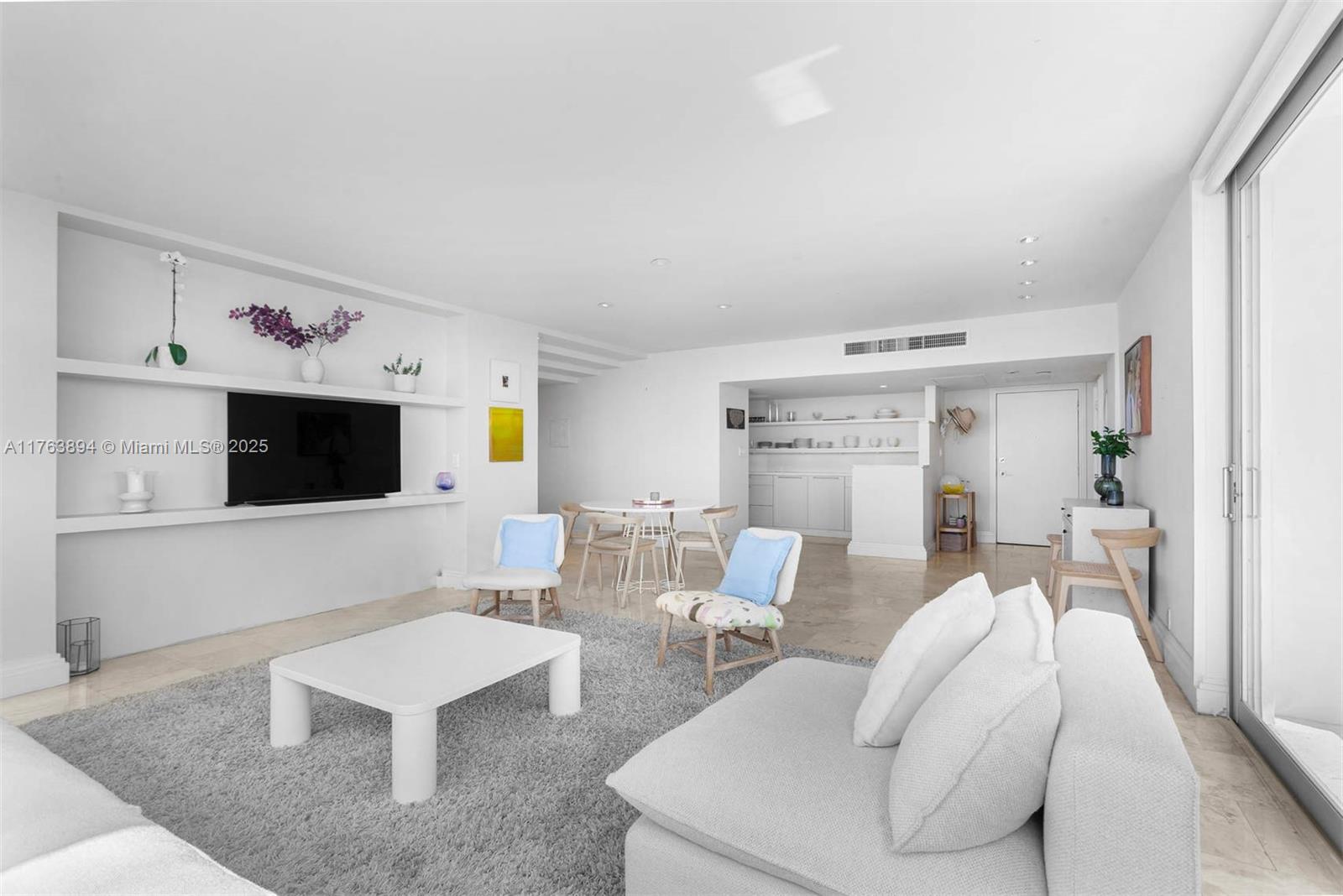 20 Island Avenue, Unit 1509 Miami Beach, FL 33139 - Photo 9 of 34 a living room with furniture and a flat screen tv