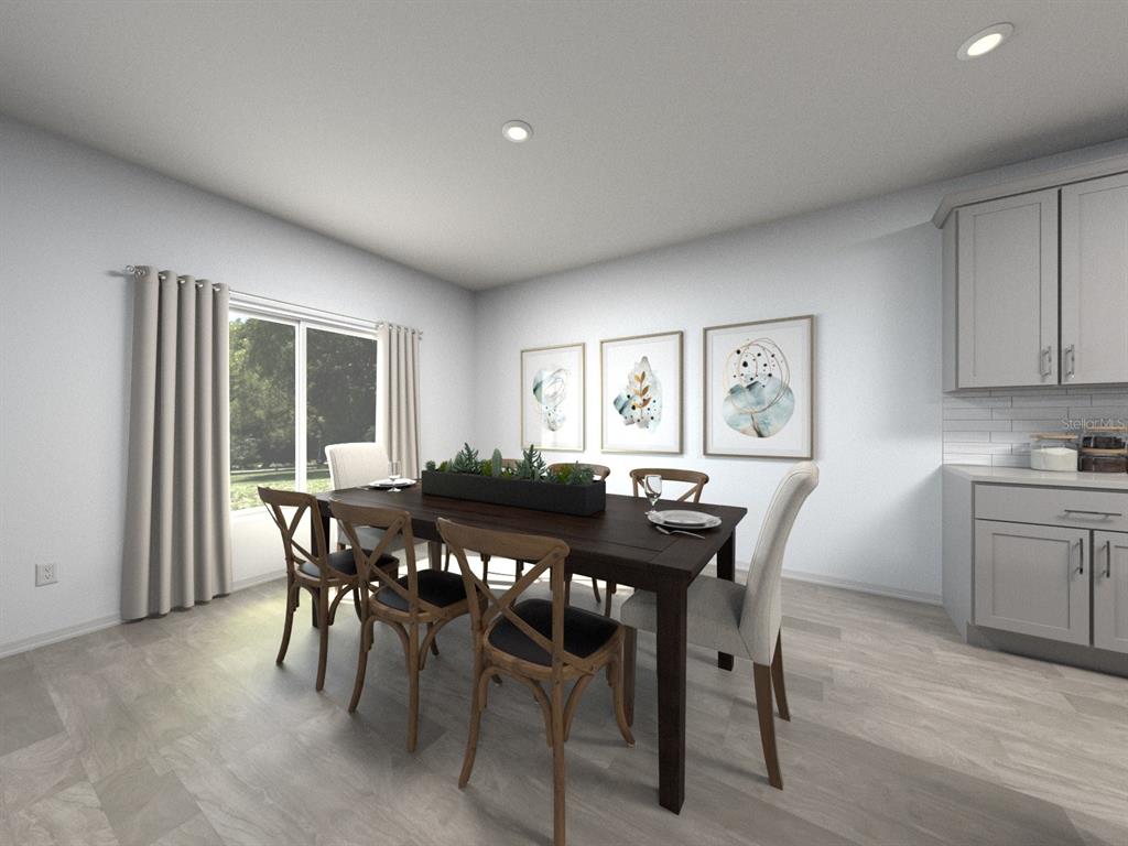 3911 Nature Sound Lane Bartow, FL 33830 - Photo 2 of 6 a view of a dining room with furniture and wooden floor
