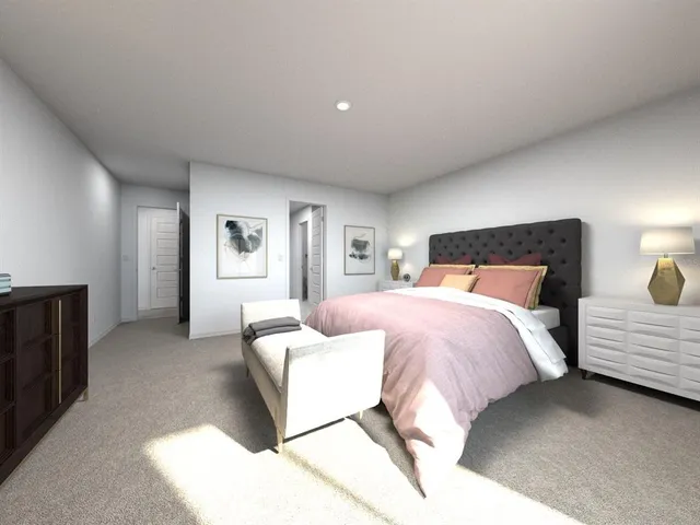 a bedroom with a bed and lamp