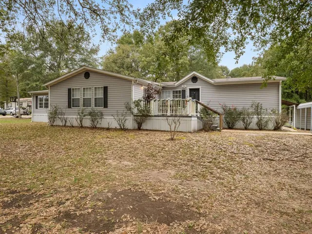 a house with trees in the background