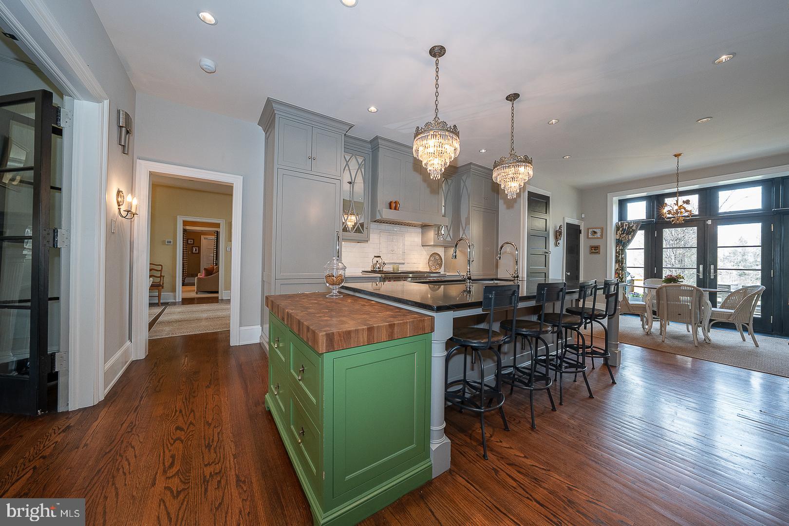 3501 Goshen Road Newtown Square, PA 19073 - Photo 33 of 79 a dining hall with stainless steel appliances granite countertop furniture wooden floor and a view of kitchen