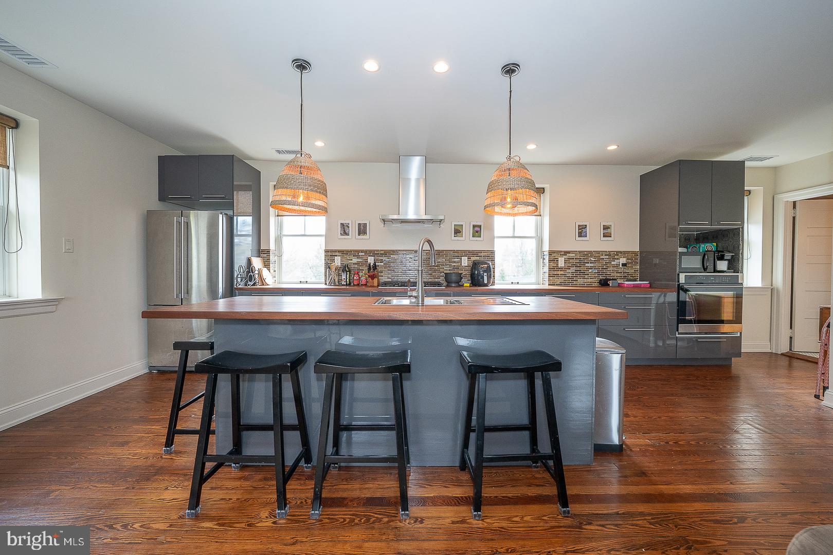 3501 Goshen Road Newtown Square, PA 19073 - Photo 57 of 79 a kitchen with stainless steel appliances granite countertop a kitchen island a stove a table and chairs