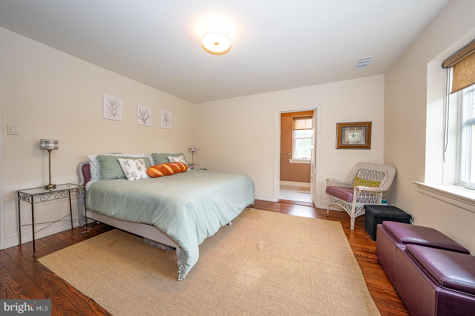 3501 Goshen Road Newtown Square, PA 19073 - Photo 62 of 79 a bedroom with a bed and wooden floor