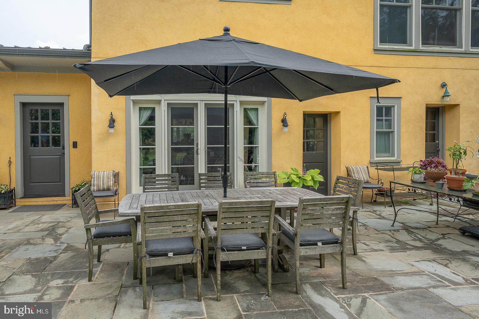 3501 Goshen Road Newtown Square, PA 19073 - Photo 71 of 79 a view of a dinning table and chairs in the patio