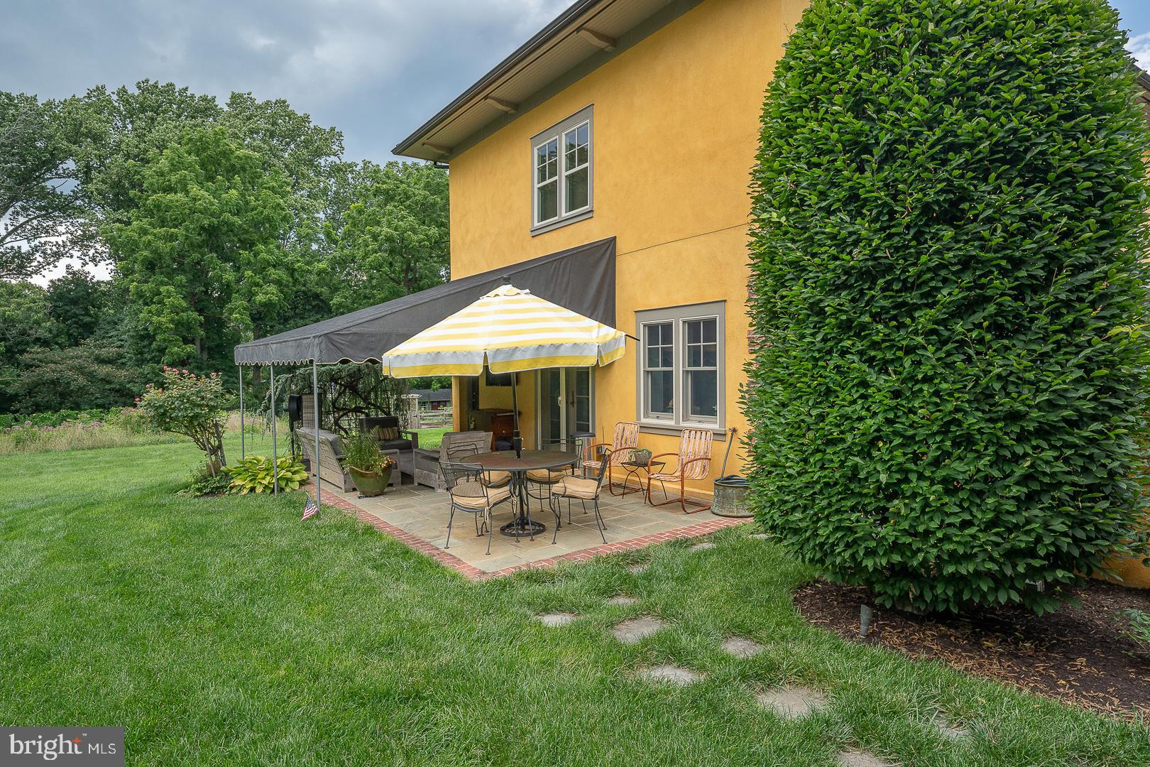 3501 Goshen Road Newtown Square, PA 19073 - Photo 72 of 79 a view of patio with table and chairs under an umbrella