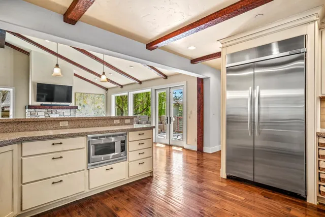 a kitchen with a stove a sink and a refrigerator