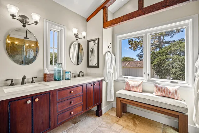 a bathroom with a bathtub shower and sink