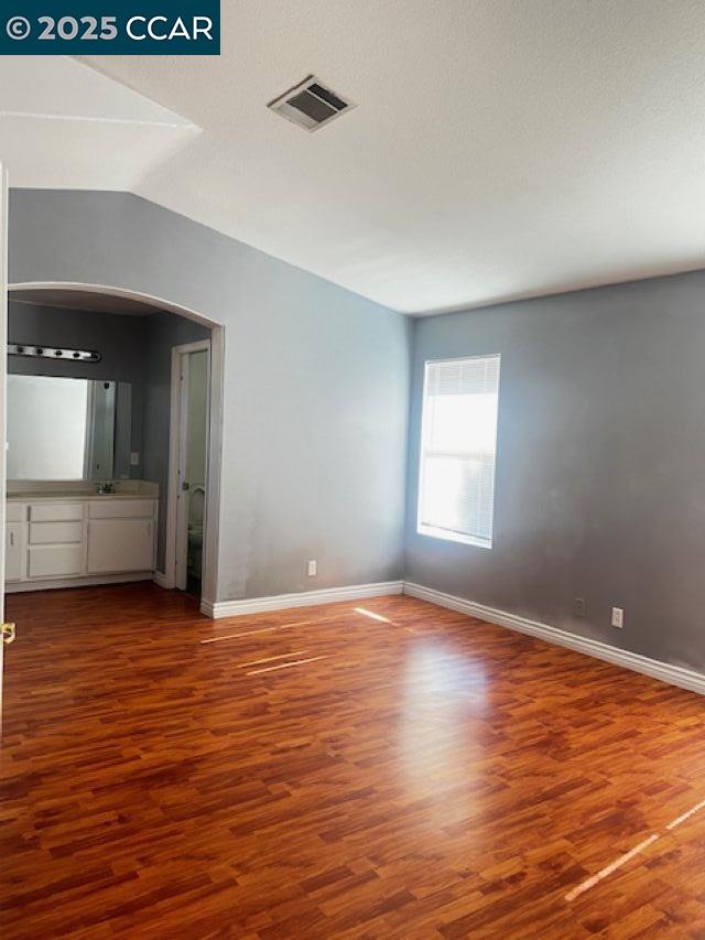 40123 Casillo Road Palmdale, CA 93550 - Photo 14 of 25 a view of an empty room with wooden floor and a window