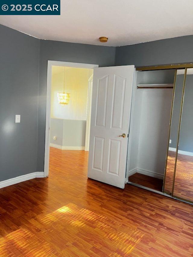40123 Casillo Road Palmdale, CA 93550 - Photo 18 of 25 an empty room with wooden floor and a window