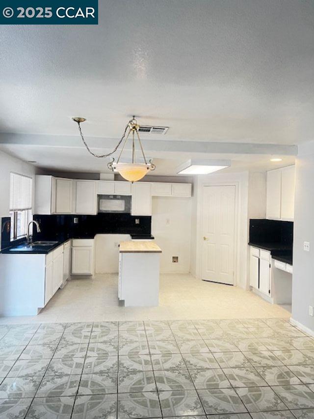 40123 Casillo Road Palmdale, CA 93550 - Photo 6 of 25 a view of a kitchen with a sink and a stove