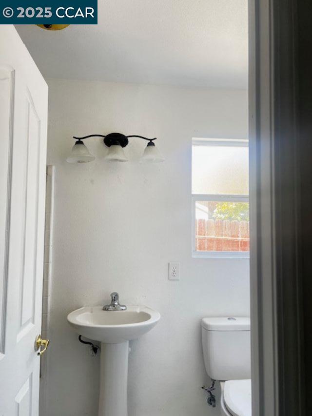 40123 Casillo Road Palmdale, CA 93550 - Photo 8 of 25 a bathroom with a sink toilet and a mirror