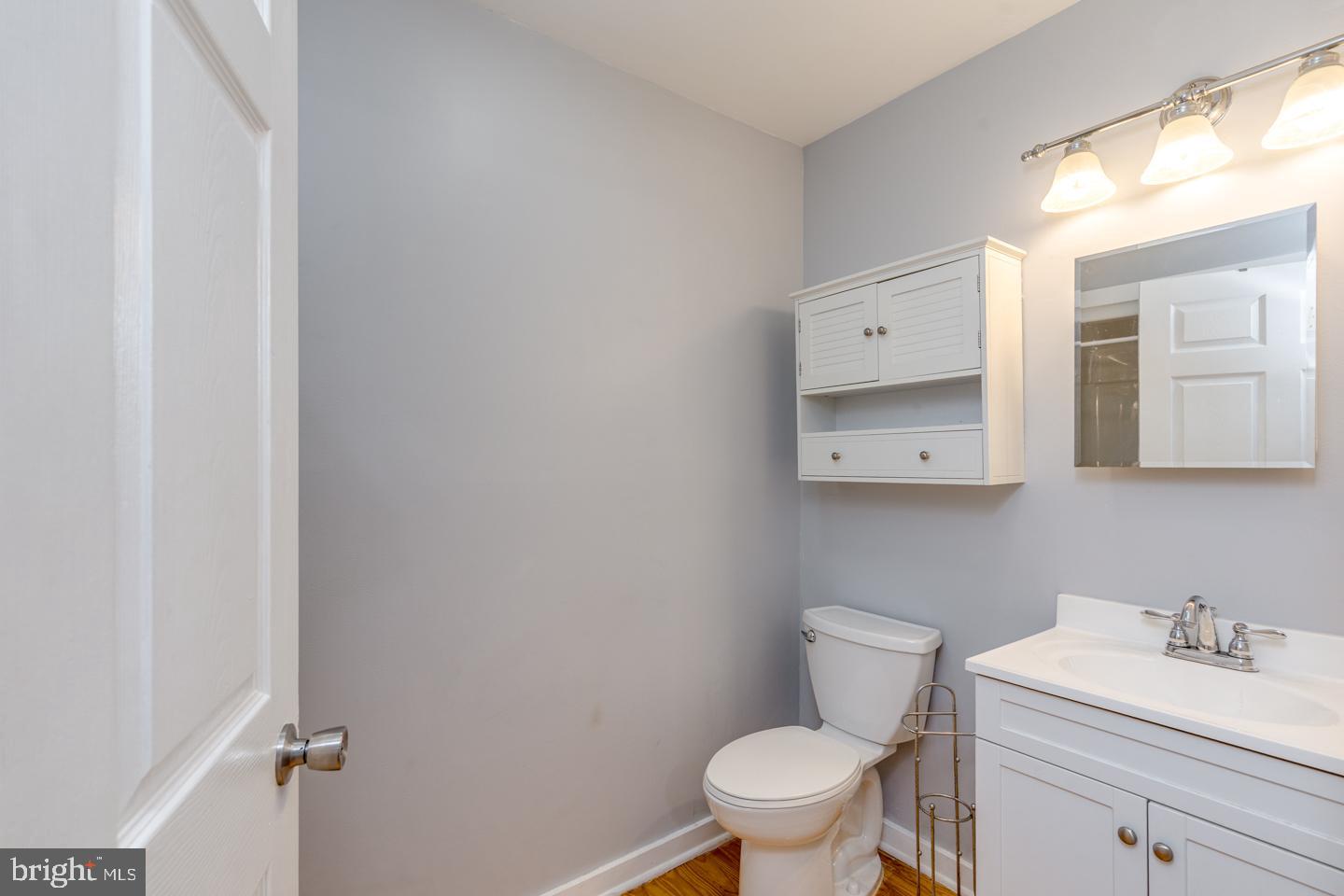 485 Main Street Lumberton, NJ 08048 - Photo 14 of 40 a bathroom with a toilet a sink and mirror