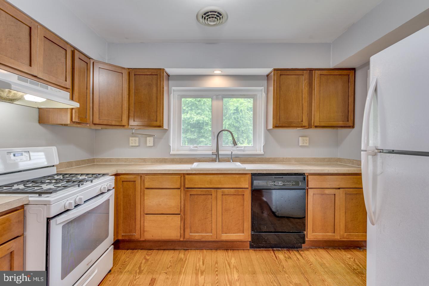 485 Main Street Lumberton, NJ 08048 - Photo 18 of 40 a kitchen with stainless steel appliances granite countertop a sink stove and cabinets