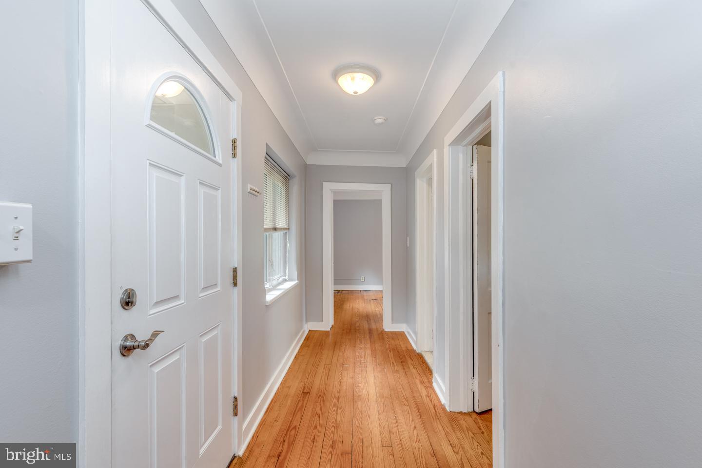 485 Main Street Lumberton, NJ 08048 - Photo 22 of 40 a view of a hallway with wooden floor and staircase