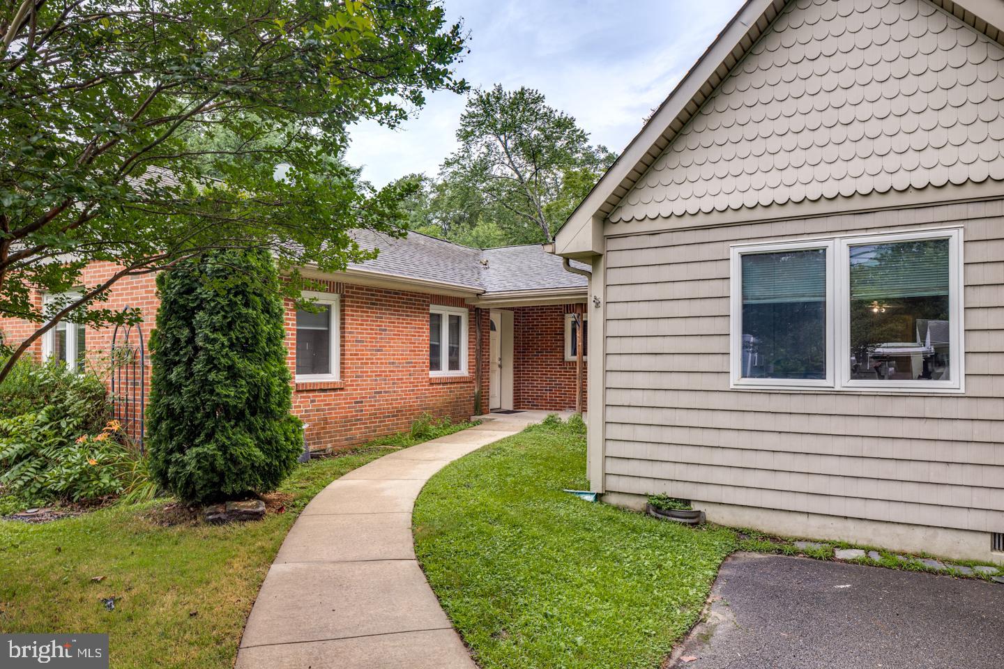 485 Main Street Lumberton, NJ 08048 - Photo 3 of 40 a front view of a house with a garden