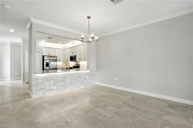 a view of a living room and kitchen