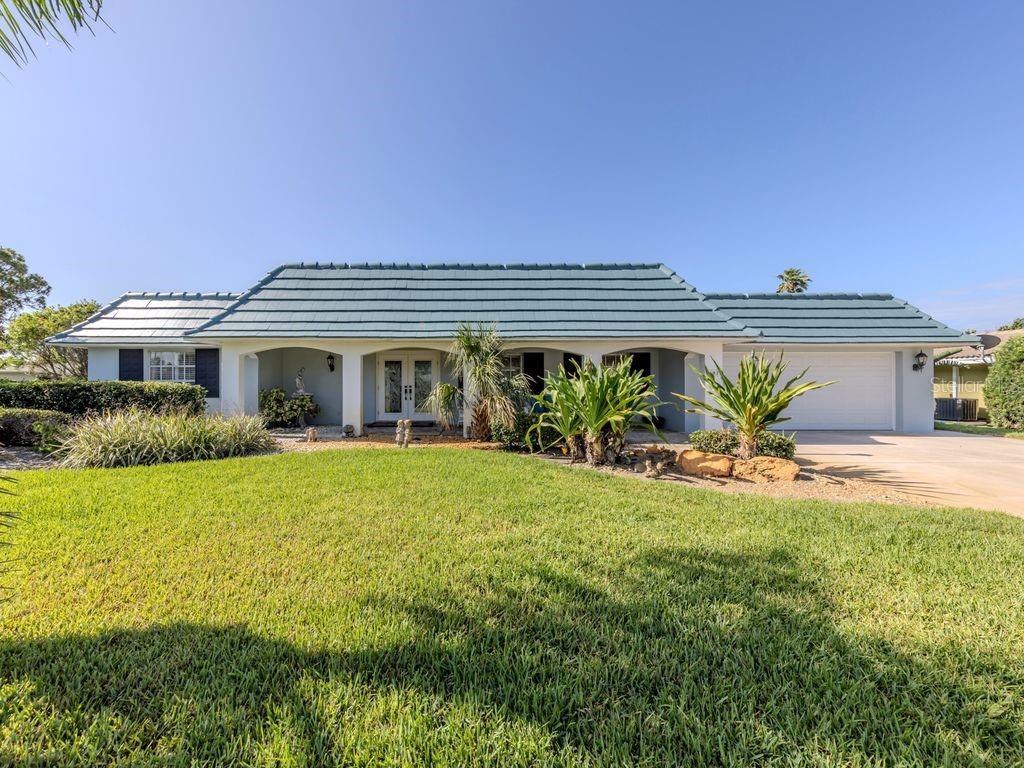 601 Apalachicola Road Venice, FL 34285 - Photo 1 of 33 a front view of a house with a yard and potted plants