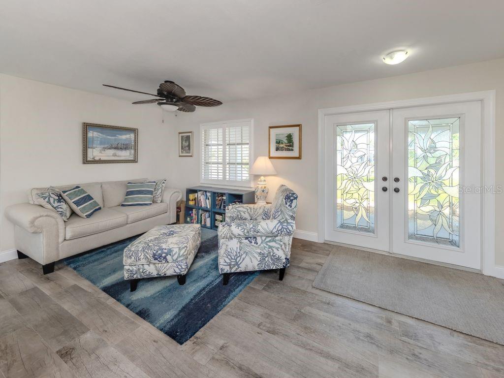 601 Apalachicola Road Venice, FL 34285 - Photo 11 of 33 a living room with furniture and a large window