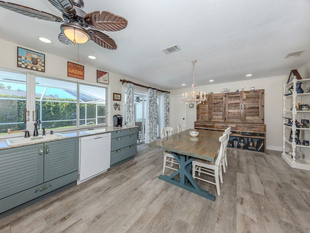 601 Apalachicola Road Venice, FL 34285 - Photo 13 of 33 a room with furniture a large window and wooden floor