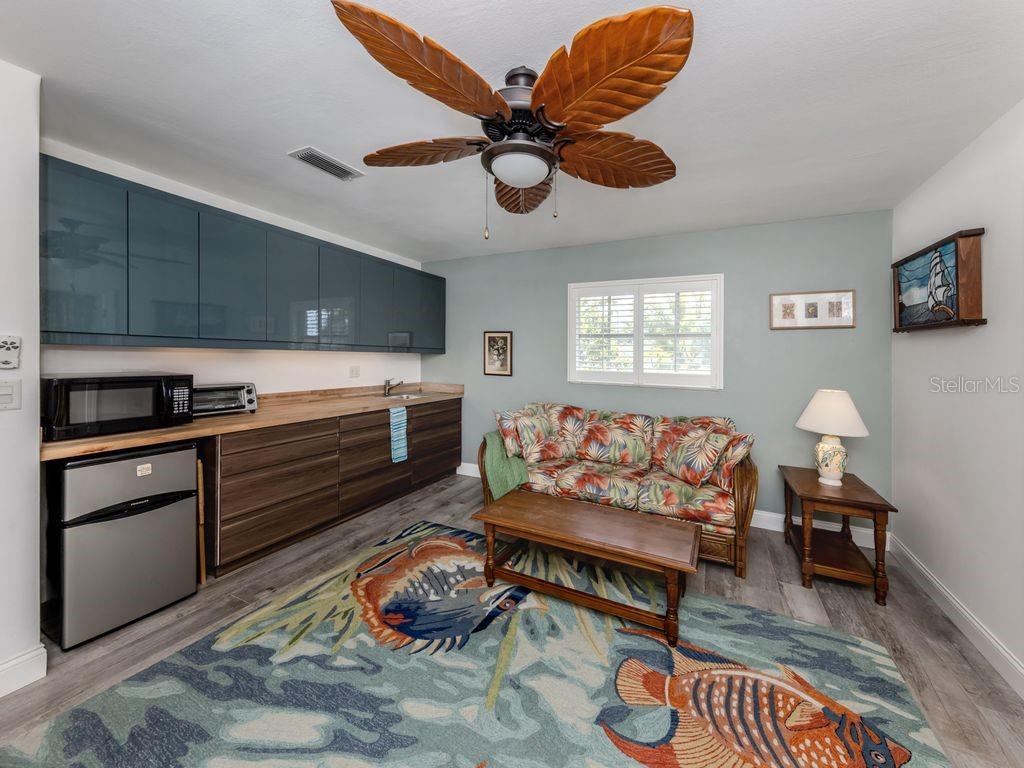 601 Apalachicola Road Venice, FL 34285 - Photo 24 of 33 a living room with furniture and a wooden floor
